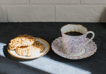 Hot morning coffee and cookies  in a sunbeam