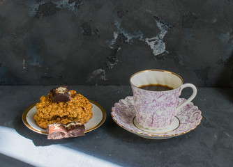 Hot coffee and cookies with chocolate in a sunbeam