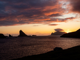 Naklejka na ściany i meble Faroe Islands, Vagar, Drangarnir, sunset view from the road to Gásadalur.