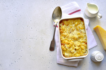 Mac and cheese - traditional american pasta casserole. Top view with copy space.