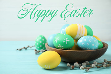 Colorful eggs and text Happy Easter on light background