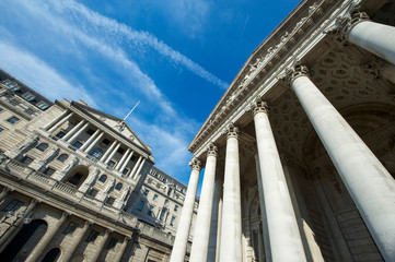 Sunny view of the facade of the Bank of England building and historic Royal Exchange under bright...