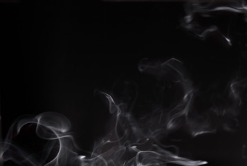 White abstract smoke on a black background.