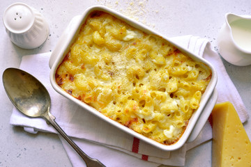 Mac and cheese - traditional american pasta casserole. Top view with copy space.