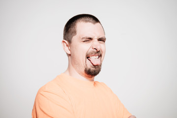 Fototapeta premium Man shows tongue