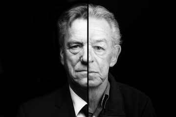 Fototapeta premium Beautiful man in front of a black background