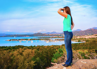 Woman looking at sunrise on Porto Rotondo resort reflex
