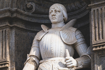 Fototapeta na wymiar King Alfonso V of Aragon, statue on the facade of the Royal Palace, Piazza del Plebiscito, Naples, Campania, Italy