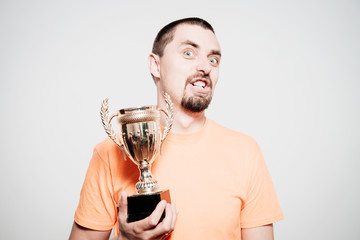 man with a golden cup
