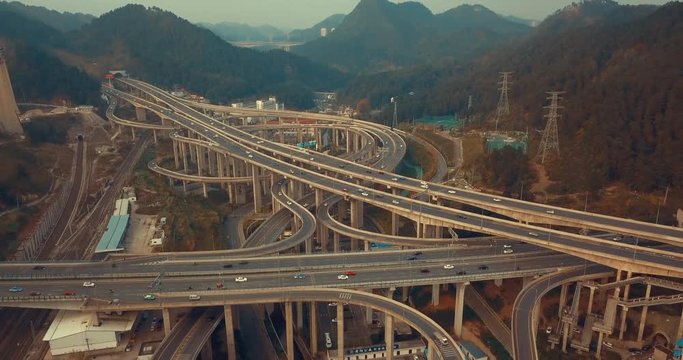 Drone 4K, aerial view of The most insane highway in all China, Qianchun interchange in the mountainous, Guiyang, China