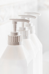 Bottles of hand sanitizer or soap in a row