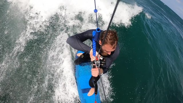 Strapless kitesurfing on a good beach break