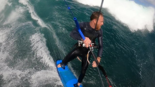 Man enjoying kitesurfing on the reef break