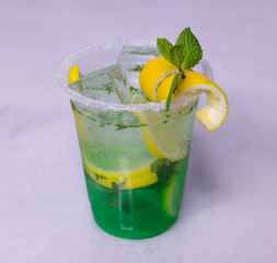 Lemon And Mint Mojito Cocktail In A Plastic Cup With Decoration 