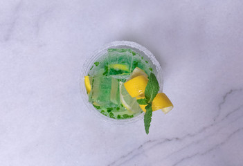 Lemon And Mint Mojito Cocktail In A Plastic Cup With Decoration 