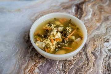 Fresh green sorrel soup, Russian special egg drop soup with vegetables, healthy soup