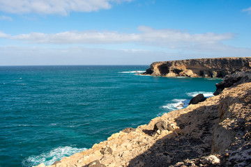 Aerial view of Black Sandy Beach, Coast of Atlantic Ocean and Cliffs in Ajuy, Furteventura, Canary Islands, Spain 