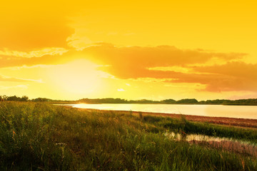 Fototapeta na wymiar Picturesque view of beautiful lake at sunset