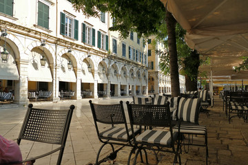 View from a bar sitting of the famous building of the city called Liston in Corfu