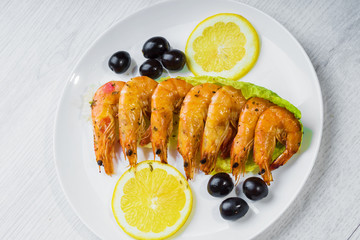 Fried langostins in a white plate