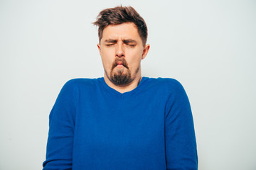 Man sucks his cheeks