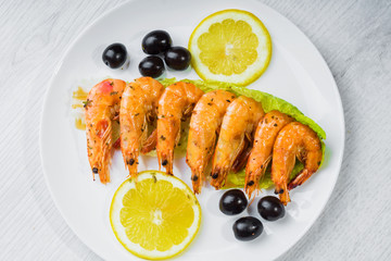 Fried langostins in a white plate