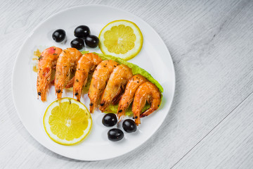 Fried langostins in a white plate