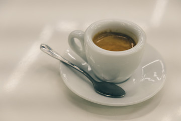 Cup of coffee over white background