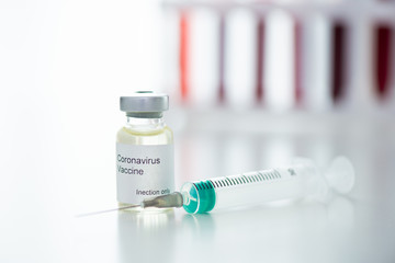 Test tubes with blood sample Covid-19 coronavirus. Vaccine and syringe injection It use for prevention, immunization and treatment from COVID