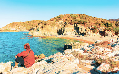 Woman in Chia Beach and Mediterranean Sea South Sardinia Italy reflex