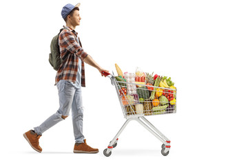 Male student with food in a shopping cart