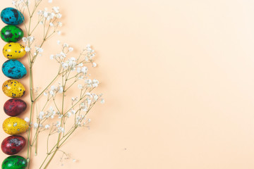 In a row laid eggs on a pink background with flowers