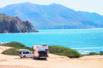 Car and Camper at Capo Pecora Mediterranean sea Sardinia