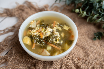 Fresh green sorrel soup, Russian special egg drop soup with vegetables, healthy soup