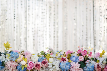 Floral arrangement with wedding flowers on white background with copy space