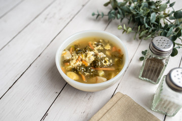 Fresh green sorrel soup, Russian special egg drop soup with vegetables, healthy soup