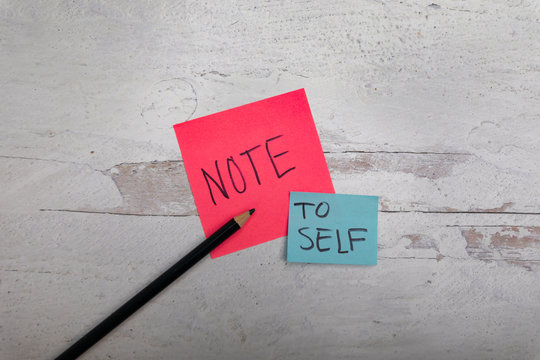 note to self message on post notes white wooden background 