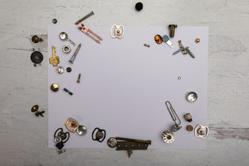 abstract background texture of metal junk nails random metal trinkets scattered about framing a...