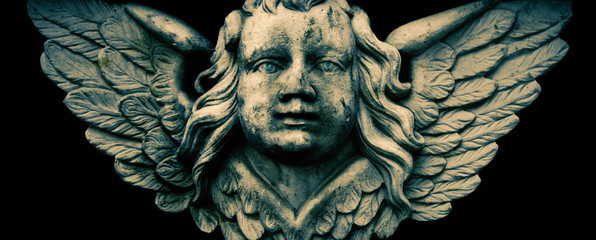 Antique stone statue of angel. Retro filter and vintage style.