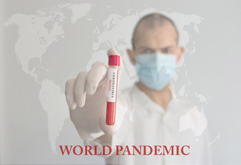 Coronavirus conceptual photo with doctor wearing a medical face mask and gloves, holding a blood test result for the COVID-19 pandemic and blurred world map in the background