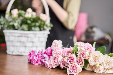 Floral shop concept . Blank for flower arrangement in a wicker basket. Beautiful bouquet of mixed...