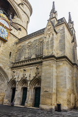 Fototapeta premium Fragment of Bordeaux Cailhau gate (Porte Cailhau, 1494) - medieval gate at Place du Palais. Gate built in Gothic Style and celebrates victory at Fornovo. Bordeaux, Gironde, Aquitaine, France.