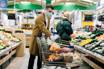 a man in a medical mask buys food at a grocery store. Coronavirus, virus, infection, epidemic, pandemic. RUSSIA, RUSSIA-MARCH 19, 2020. OBNINSK