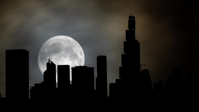 Bogota: Time Lapse by Night with Full Moon and Skyscrapers in Silhouette, Bogot&agrave; Distrito Capital, Colombia