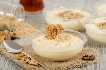 Turkish desert keskul rice pudding with hazelnut powder stock photo