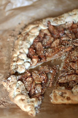 Rustic galette with apples and nuts. Selective focus.