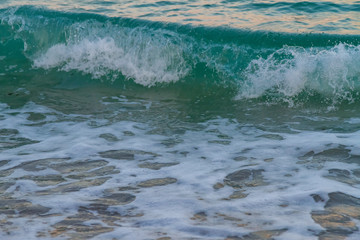 sea water with a wave tending to the shore