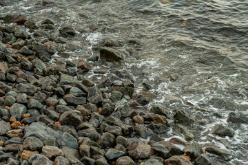 sea water with a wave tending to the shore