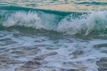 sea water with a wave tending to the shore