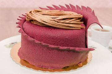 Birthday cake decorated with colorful sauce